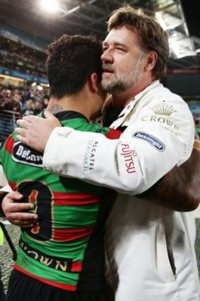 Master and Commander: Issac Luke (left) and Russell Crowe embrace after the preliminary final victory over Sydney Roosters.
