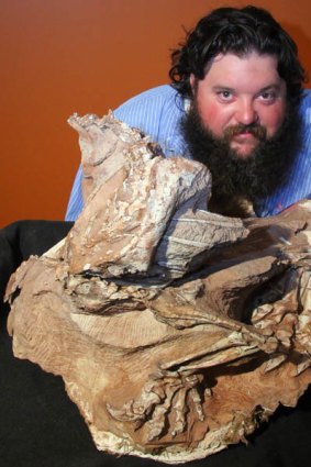 Paleontologist Mark Loewen with the fossil.