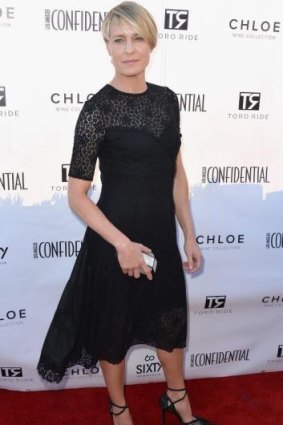 Picture perfect: Actress Robin Wright looks lovely in a vintage Nina Ricci dress and Stewart Weitzman shoes.
