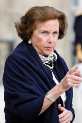 Liliane Bettencourt leaves the presidential Elysee Palace in Paris in 2007. Mr Sarkozy was cleared last year of claims he took the heiress' money when she was too frail to comprehend.