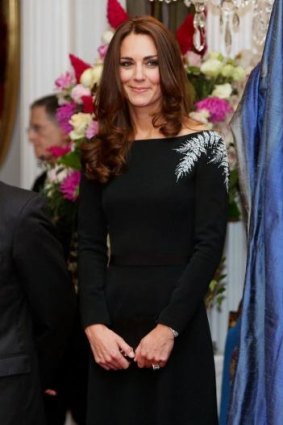 Kate wears a black dress embroidered with a silver fern to Government House in Wellington.