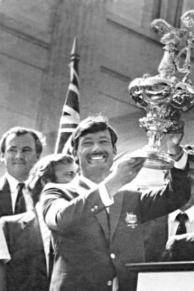 The prize: John Bertrand holds the America's Cup aloft in 1983.