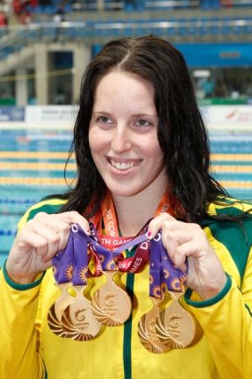 New face of the pool ... Coutts displays her five gold medals.
