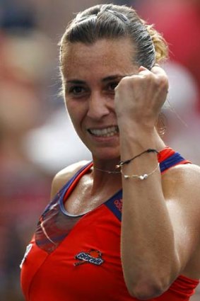 Flavia Pennetta of Italy celebrates her win over Simona Halep of Romania.