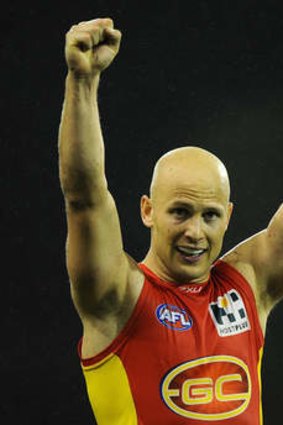 Gary Ablett celebrates the Suns' victory over North Melbourne.