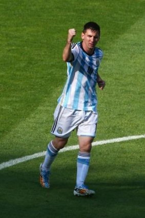 Lionel Messi celebrates scoring the winning goal for Argentina against Iran.