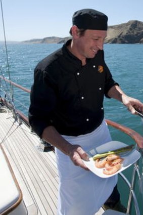 Cooking up local produce on board.