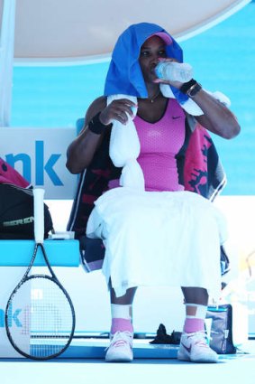 Hot stuff: Serena Williams tries to cool off in her match against Daniela Hantuchova.