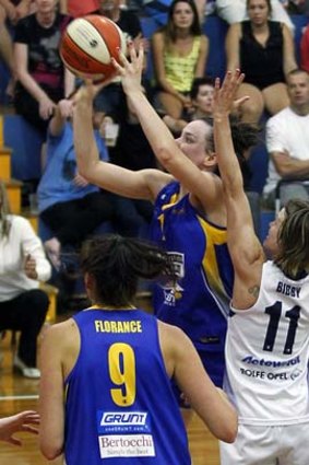 Last chance: Tess Madgen lands the winning shot for the Boomers.