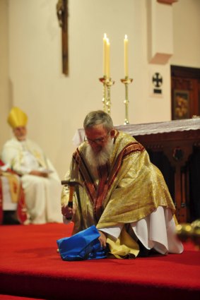 Bishop Michael Hough smashes his precious chalice.