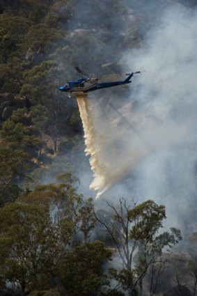 One of the four helicopters enlisted to battle the blaze.