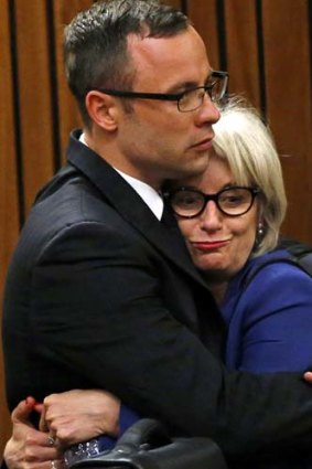 Drama: Oscar Pistorius and his aunt Lois after the prosecution closed its case.