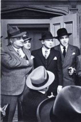 Frank Sinatra (third from left) and Sammy Davis Jr (centre, holding the gun) are loveable rogues in <i>Robin and the 7 Hoods</i> (1964).