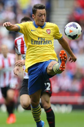 Sublime control: Arsenal midfielder Mesut Ozil displays his skills in his opening game for the club.