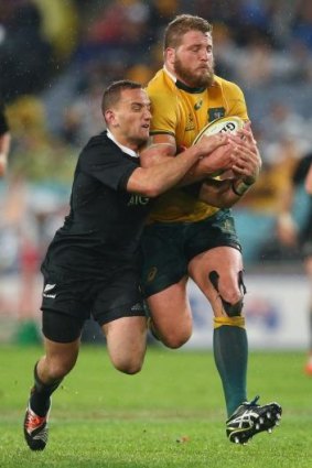 James Slipper takes Aaron Cruden along for the ride in Bledisloe I this year.