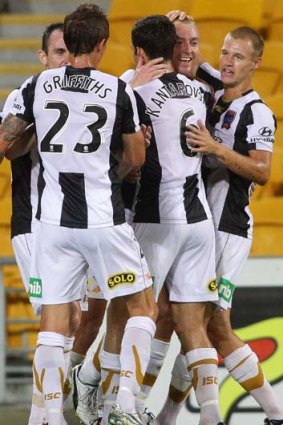 Winning goal &#8230; Newcastle players celebrate in Brisbane.
