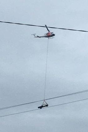 Up and away: A helicopter had to be brought in to retrieve the Toyota Hilux from the cliff top, at a cost of $20,000.