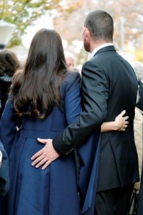 Protective embrace: James Packer and his ex-wife.