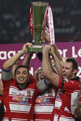 Winning Warriors . . .Wigan players celebrate their victory.