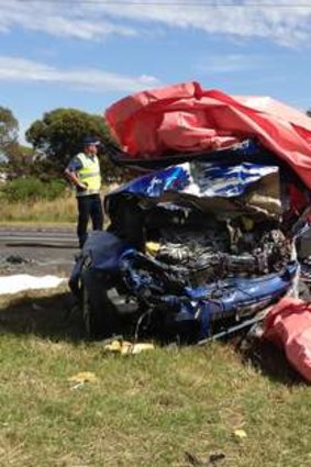 A wrecked car in which four people died near Lara (left) after a collision with another vehicle being driven the wrong way on the freeway by a driver who also died.