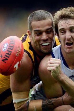 Tight: Hawthorn's Lance Franklin and Fremantle's Michael Barlow.