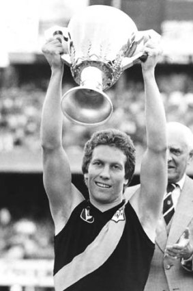 Inspirational: Bruce Monteath with the 1980 premiership cup.