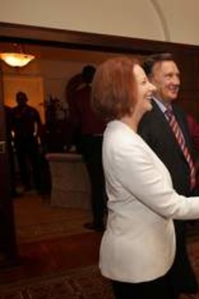 Prime Minister Julia Gillard and her partner Tim Mathieson greet West Indies cricket player Chris Gayle at The Lodge.