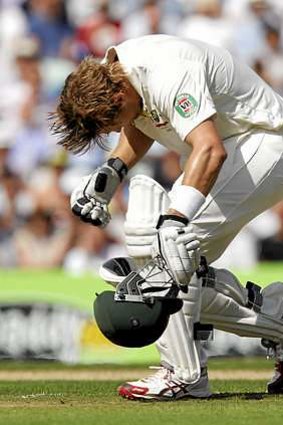 Reeling: Watson stumbles after being hit by a bouncer.