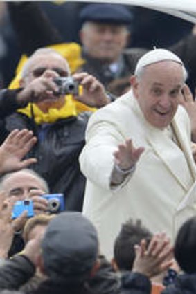 Mass appeal ... Pope Francis greets the crowd as he arrives at St Peter's square on January 22, 2014 at the Vatican.