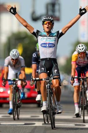 Matteo Trentin of Italy and Omega Pharma-Quickstep celebrates as he wins stage 14 of the Tour de France.