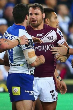 Fiery ... Manly's Anthony Watmough and the Bulldogs' Michael Ennis in a heated exchange.