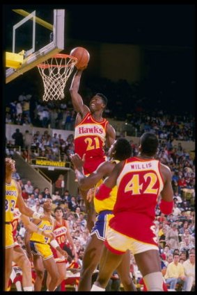 The Human Highlight Reel: Forward Dominique Wilkins of the Atlanta Hawks drives hard to the hoop during his decorated NBA career.
