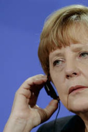 Guarded ... German Chancellor Angela Merkel remaining tight-lipped on Britain's EU demands.
