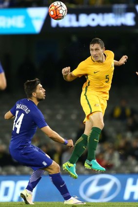 Socceroo Mark Milligan in action against Greece last year.