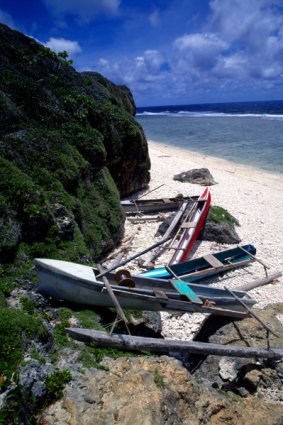 Peaceful ... canoes on the beach in Mangaia.