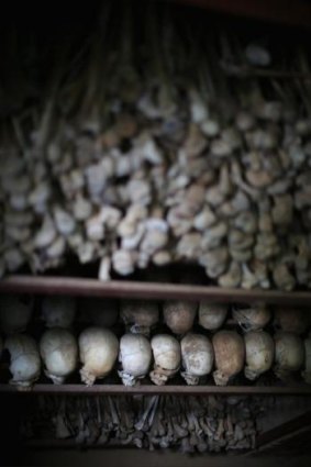 Metal racks hold the bones of thousands of  genocide victims inside one of the crypts at the Nyamata Catholic Church memorial.