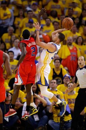 Clipped: Golden State's Stephen Curry shoots over LA's Darren Collison.