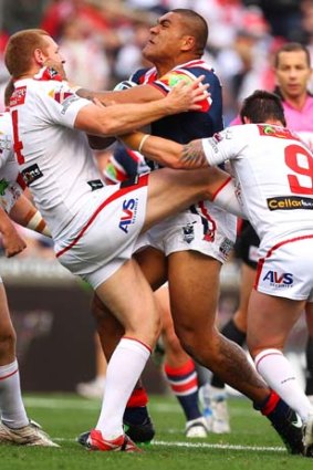 Mose Masoe of the Roosters runs into some solid Dragons defence.