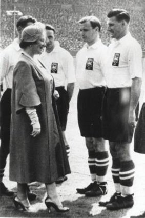 Joe Marston, the first Australian to play professionally in the UK, being presented to the Queen Mother in 1954 at Wembley.