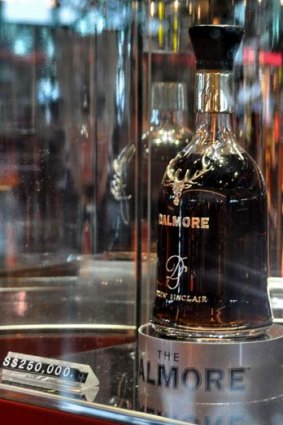 A rare bottle of whisky known as a Dalmore 62 inside a glass case at a duty-free shop in Singapore's Changi Airport.
