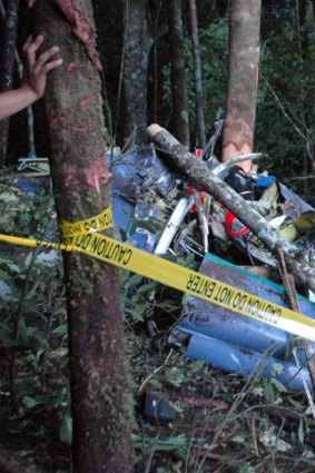 The helicopter wreckage from yesterday's crash in Indonesia, which claimed the lives of 10 people including two Australians employed by Newcrest Mining.