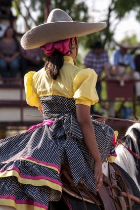 A traditional Mexican escaramuza – a competition performed on horseback by women.