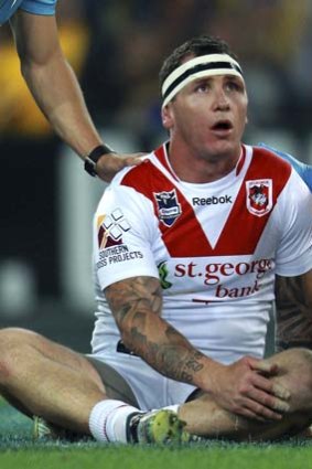 Stunned: The Dragons' Josh Miller after being hit.