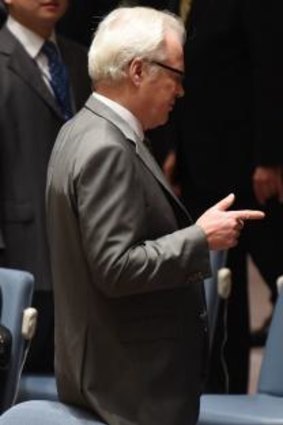 Power of two: Russian ambassador to the United Nations Vitaly Churkin speaks with his Chinese counterpart Liu Jieyi at a UN Security Council meeting on Syria on July 14.