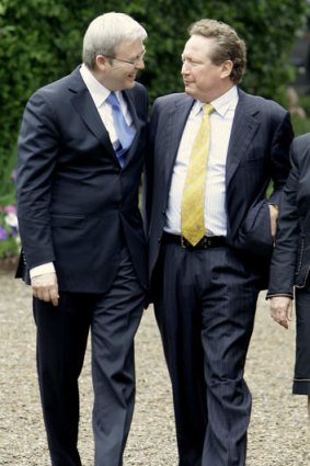 Australian Prime Minister Kevin Rudd embraces billionaire mining mogul Andrew Forrest.