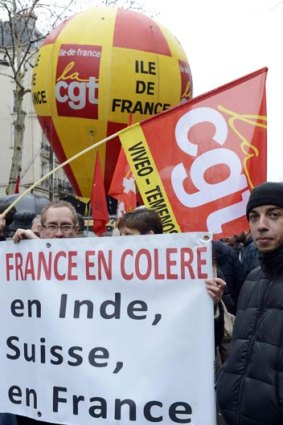French workers demonstrate in Paris against the low wages and poor conditions of temporary workers.