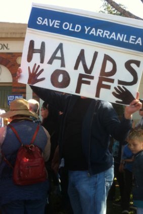 A protestor pleads for Old Yaranlea school to remain open on Griffith University grounds.