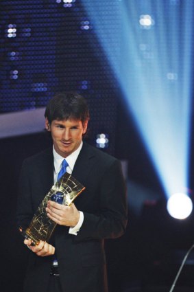 Football player Lionel Messi from Argentina poses with the trophy after being named FIFA World Player of the Year during the FIFA World Player Gala 2009 at the Kongresshaus in Zurich, Switzerland.