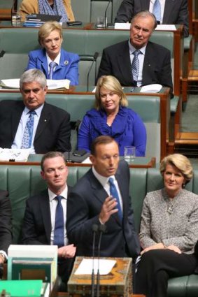 Jane Prentice sporting a blue tie sits behind then Opposition Leader Tony Abbott.