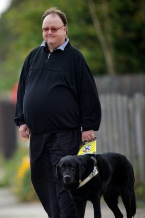 Murray Rowland with his guide dog, Zarr.